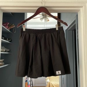 Pleated Black Mini Skirt with “A” Emblem